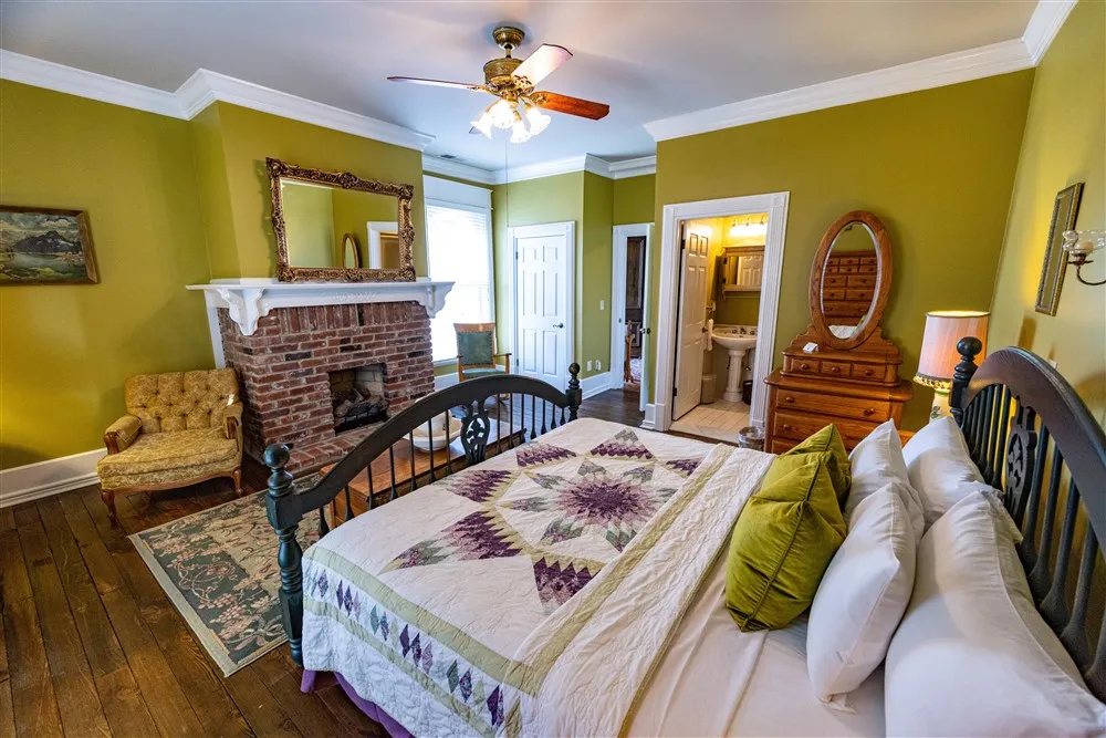 bedroom with rustic furnishings at the Manor at Legacy Farms